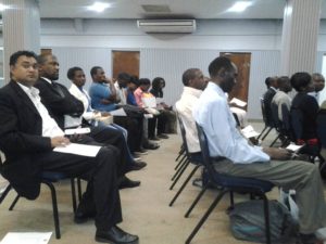 an audience following the procedures and presentations